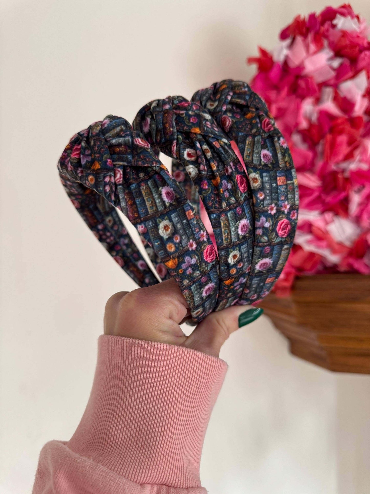Enchanted Books Top Knot Headband, Step into a storybook world with our Enchanted Books Top Knot Headband. Featuring a darker floral print inspired by classic library tales, this low top knot headband adds a whimsical, Beauty and the Beast–inspired charm