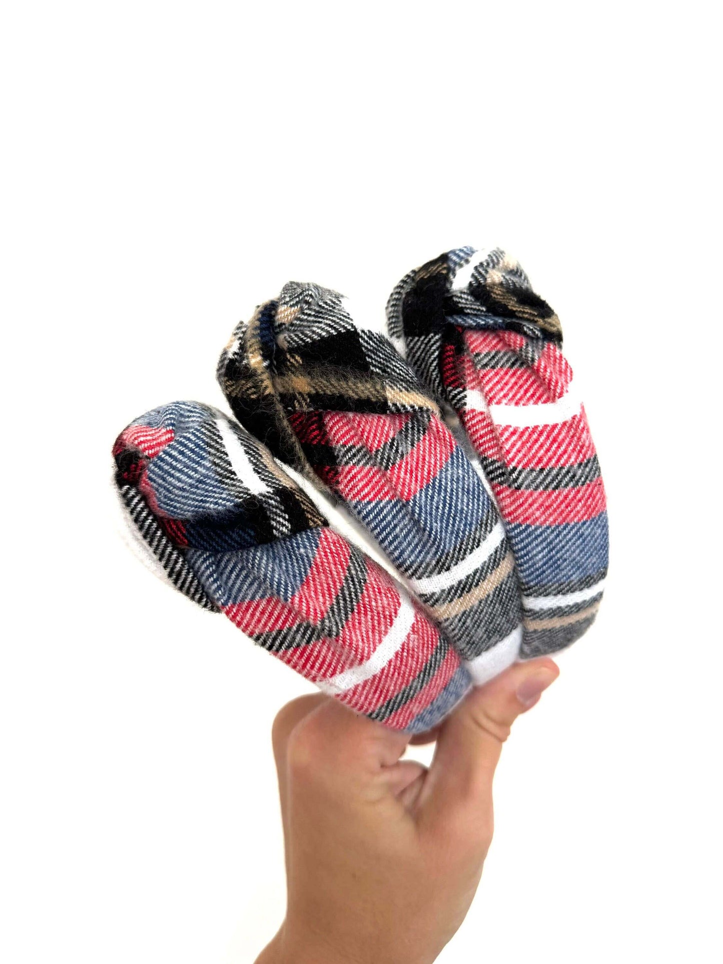 Holiday Plaid Top Knot Headband, Add a festive touch with this subtle holiday plaid top knot headband. Its classic plaid pattern brings cozy charm while the playful top knot adds a fun twist to any outfit. Perfect for holiday gatherings or everyday cheer,