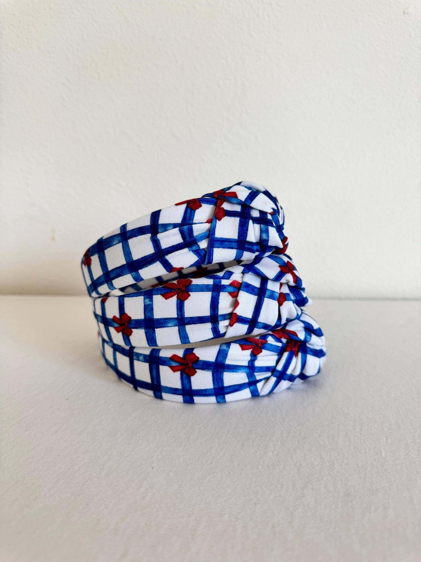 Summery Blue Gingham Red Bows Headband, Show your patriotic spirit with this handmade headband. Perfect for the 4th of July, Memorial day, or any day you're feeling festive, this will add the perfect touch of Americana to your outfit. Stylish, secure, and