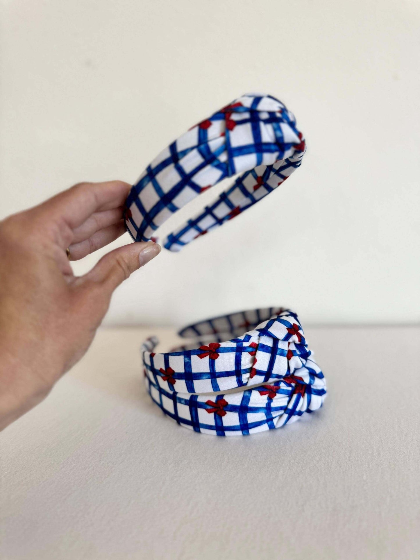 Summery Blue Gingham Red Bows Headband, Show your patriotic spirit with this handmade headband. Perfect for the 4th of July, Memorial day, or any day you're feeling festive, this will add the perfect touch of Americana to your outfit. Stylish, secure, and