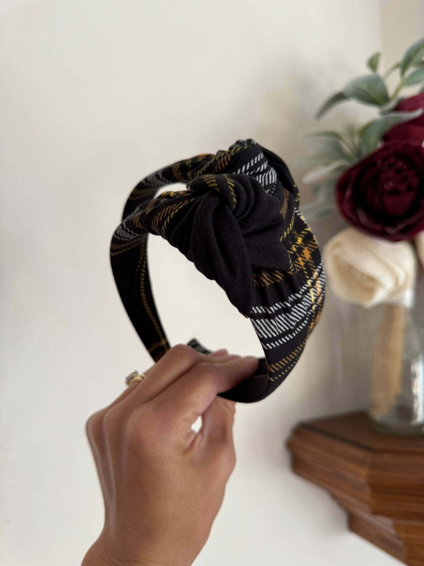 Blair Black Plaid Top Knot Headband, Add a touch of cozy charm to any outfit with the Blair Black Plaid Top Knot Headband. Its classic black plaid pattern pairs perfectly with casual looks, while the playful top knot adds a flirty finish. Soft and stretch