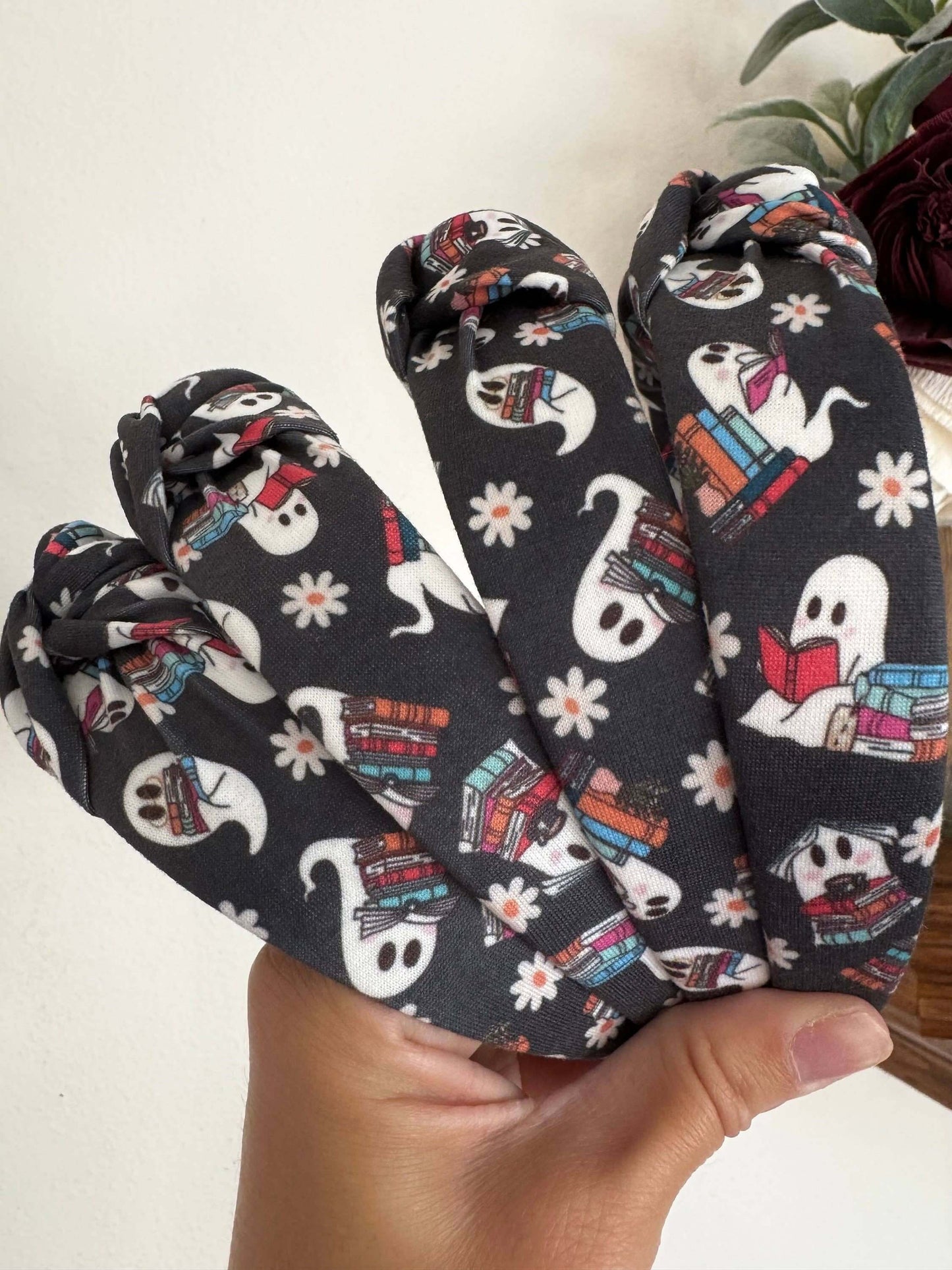 Halloween Book Nerd Ghosts Topknot Headband, Get ready for Halloween with these cutie ghosts - book in hand and ready for some fun. Fit: These headbands fit sizing 2 years up to 99 years +. The base is bendable and can bend to any head size! You'll notice