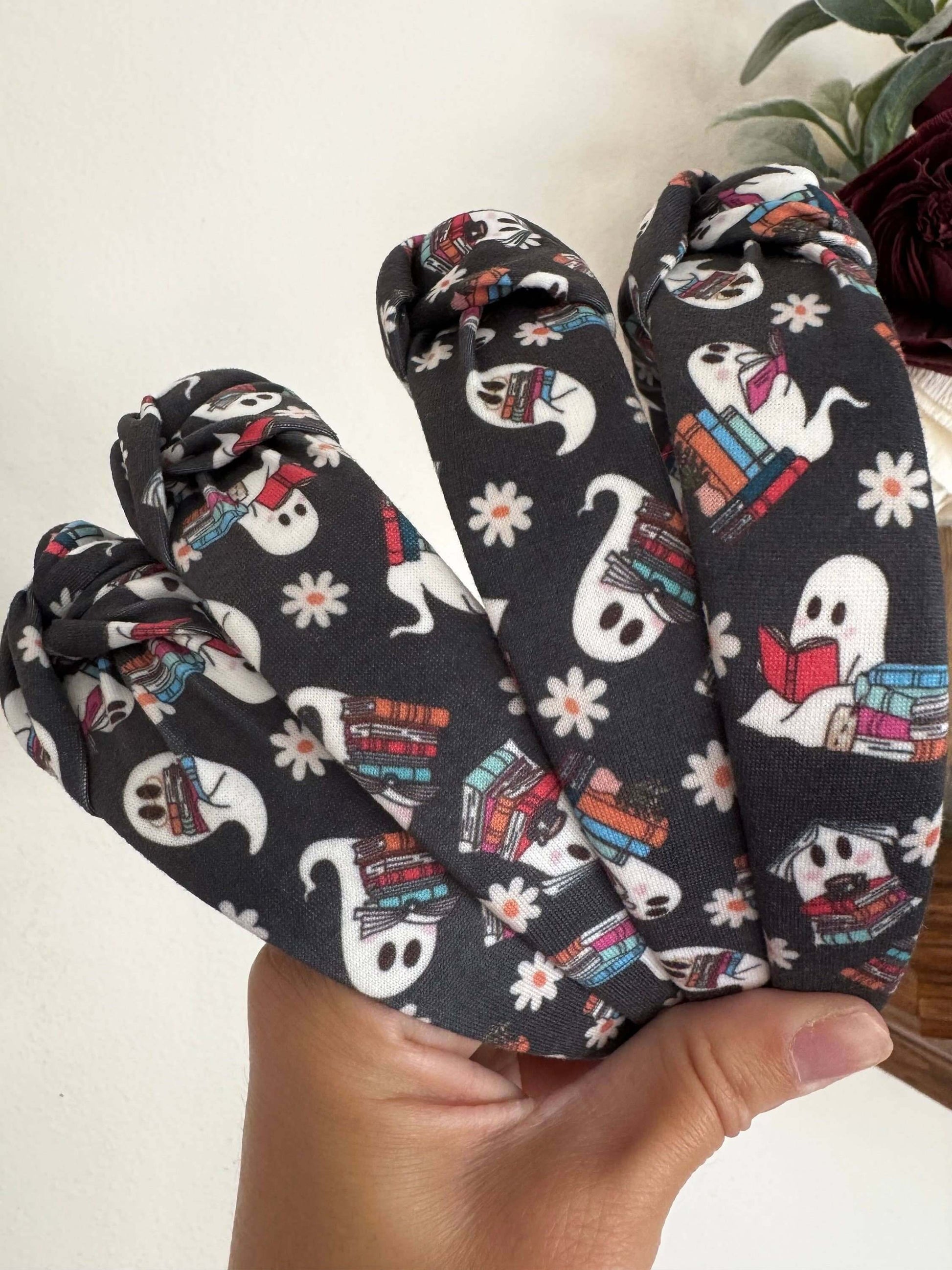Halloween Book Nerd Ghosts Topknot Headband, Get ready for Halloween with these cutie ghosts - book in hand and ready for some fun. Fit: These headbands fit sizing 2 years up to 99 years +. The base is bendable and can bend to any head size! You'll notice
