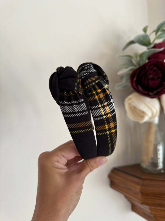 Blair Black Plaid Top Knot Headband, Add a touch of cozy charm to any outfit with the Blair Black Plaid Top Knot Headband. Its classic black plaid pattern pairs perfectly with casual looks, while the playful top knot adds a flirty finish. Soft and stretch
