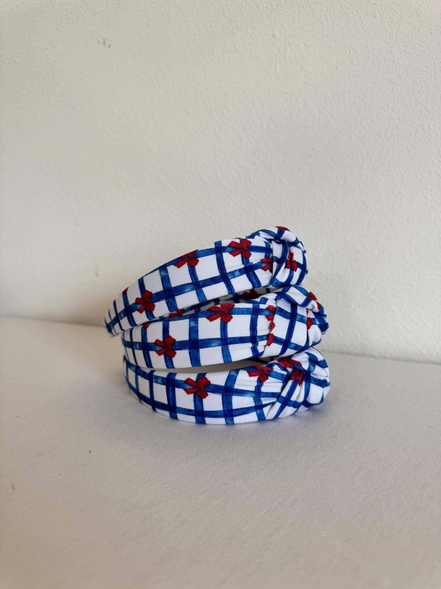 Summery Blue Gingham Red Bows Headband, Show your patriotic spirit with this handmade headband. Perfect for the 4th of July, Memorial day, or any day you're feeling festive, this will add the perfect touch of Americana to your outfit. Stylish, secure, and