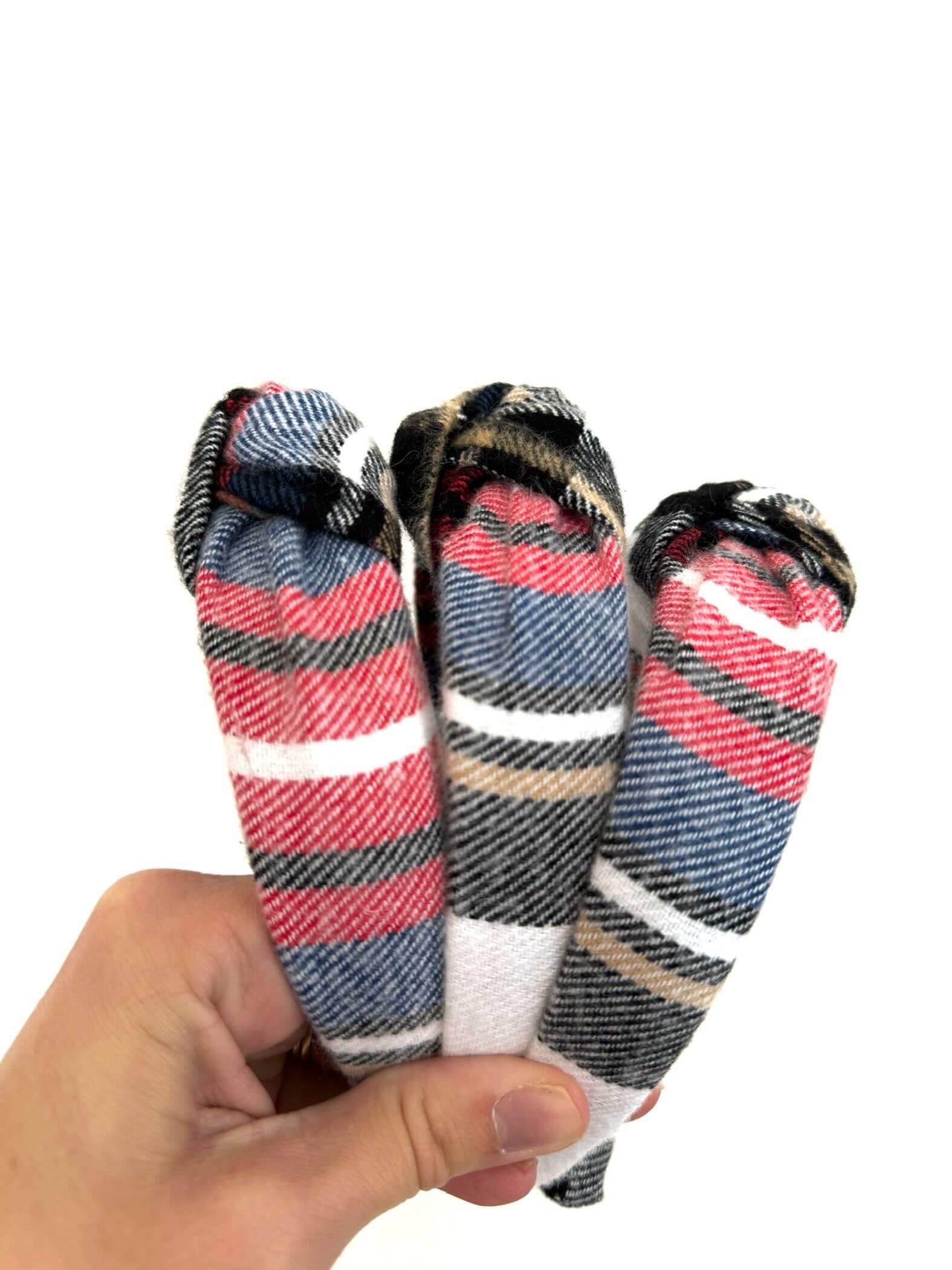 Holiday Plaid Top Knot Headband, Add a festive touch with this subtle holiday plaid top knot headband. Its classic plaid pattern brings cozy charm while the playful top knot adds a fun twist to any outfit. Perfect for holiday gatherings or everyday cheer,