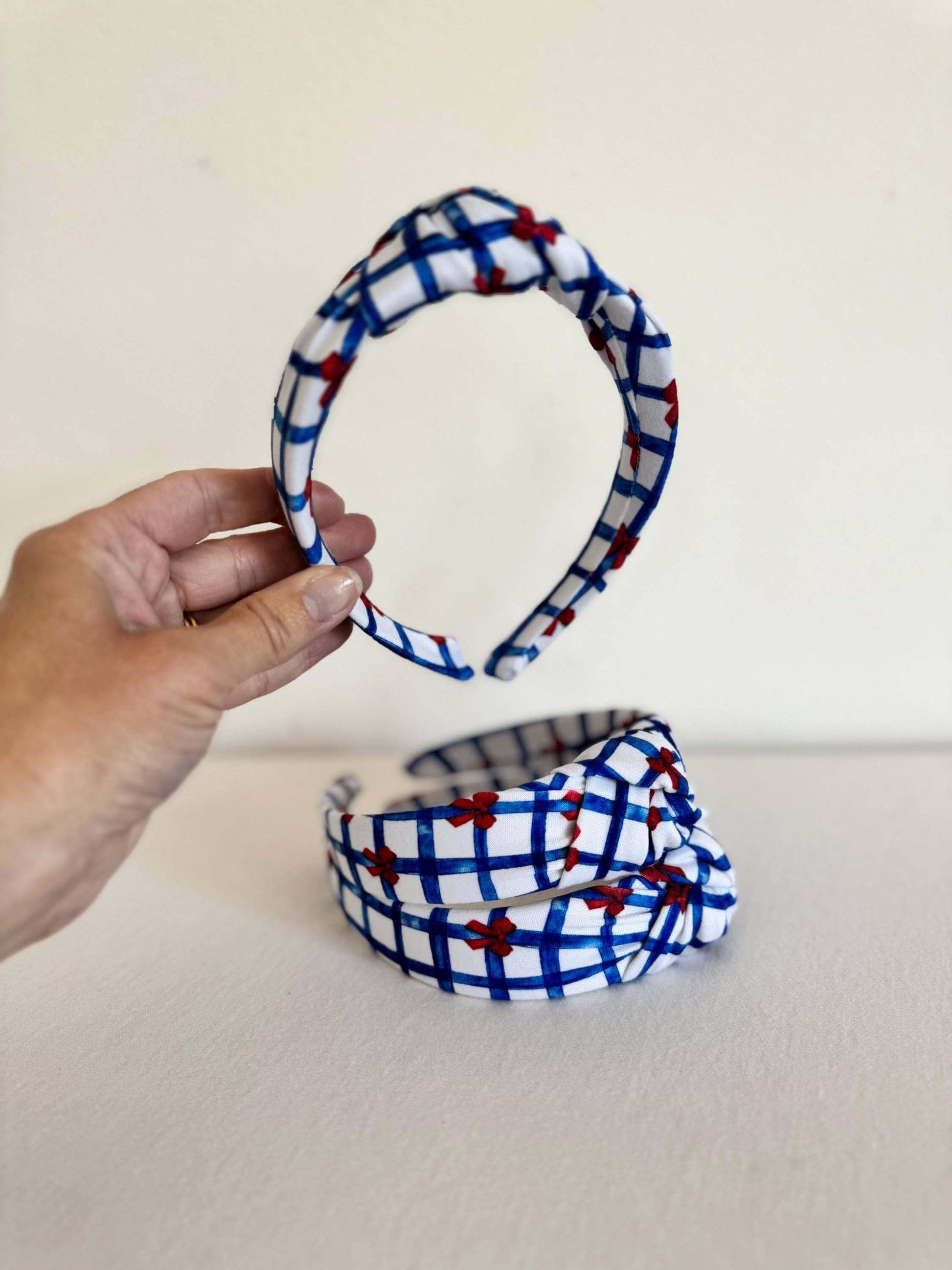 Summery Blue Gingham Red Bows Headband, Show your patriotic spirit with this handmade headband. Perfect for the 4th of July, Memorial day, or any day you're feeling festive, this will add the perfect touch of Americana to your outfit. Stylish, secure, and