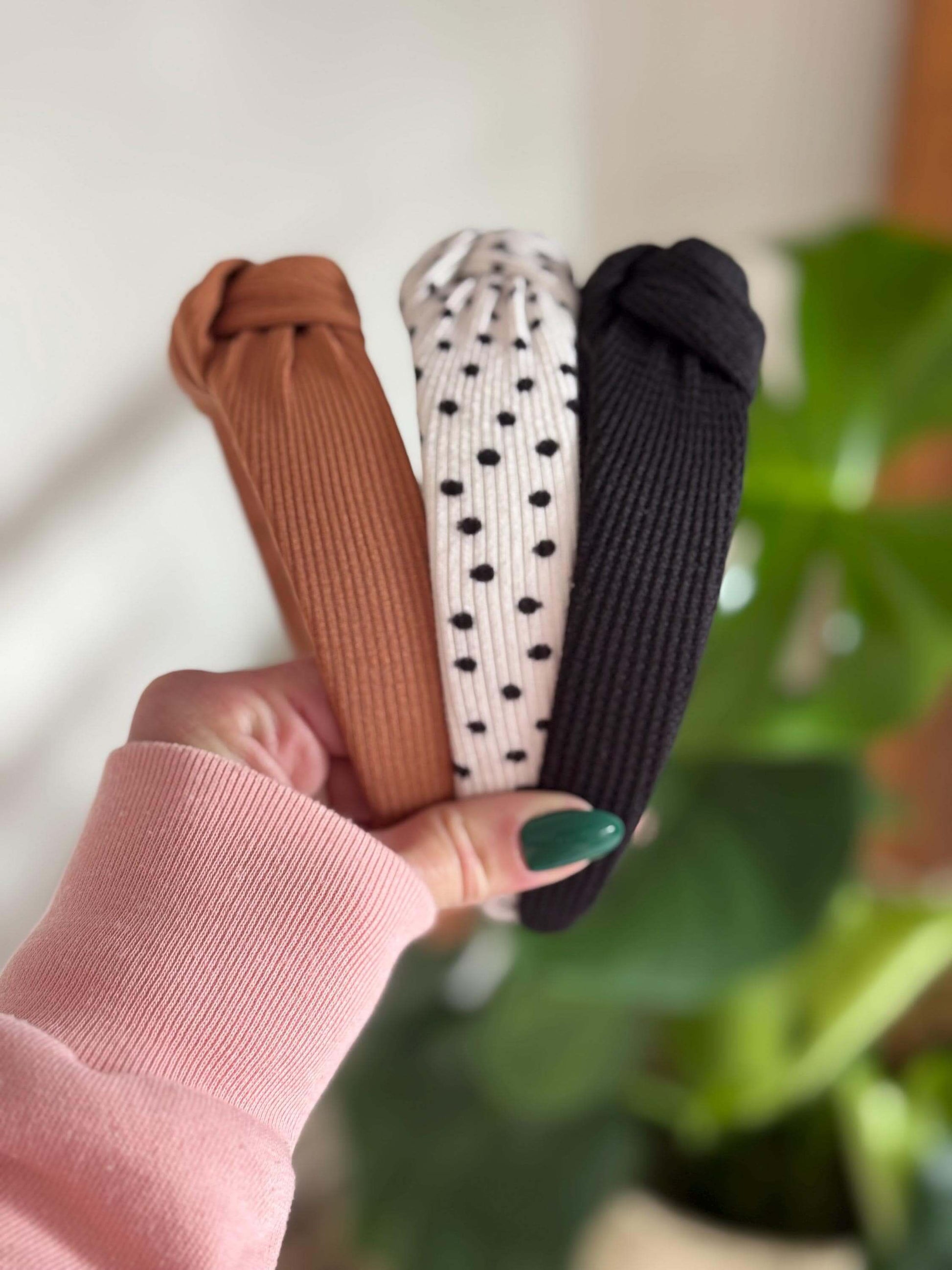 Polka Dotted Knotted Neutral Headband, Add a fun twist to your look with this white ribbed headband adorned with classic black polka dots. Its topknot design brings a playful vibe while keeping your style effortlessly neutral and versatile. Perfect for an